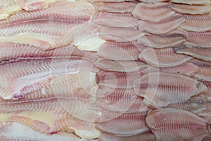 Fresh fish. Fish fillet laid out on the counter. Close-up. Abstract natural background of fresh fish photo