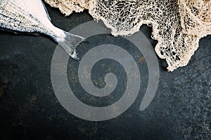 Fresh Fish with fishing net photo