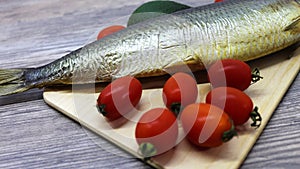 Fresh fish and vegetables on a cutting board