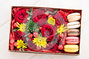 Fresh flower in box and macaroon