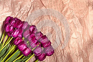 Fresh flower composition, bouquet purple tulips on craft paper background. Valentine, Women`s, 8 march, birthday, mother