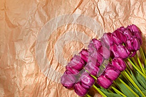 Fresh flower composition, bouquet purple tulips on craft paper background. Valentine, Women`s, 8 march, birthday, mother