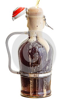 Fresh foam spilling down an over filled growler