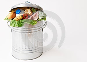 Fresh Food In Garbage Can To Illustrate Waste photo