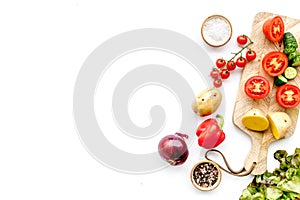 Fresh food ingredients for vegetarian kitchen on white background top view mock-up