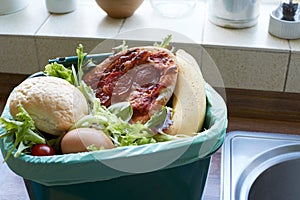 Fresh Food Waste In Recycling Bin At Home photo