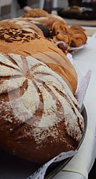 Fresh fragrant bread on the table, round loaf of bread.