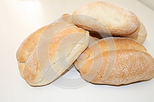 Fresh and fragrant bread on a white table