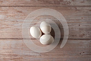 Fresh free range eggs on wooden table