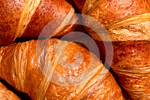 Fresh French croissants close-up. Homemade baking background