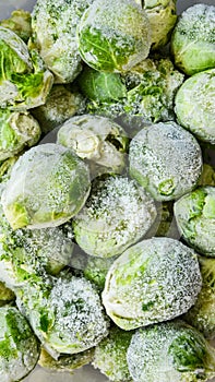 Fresh frozen brussels sprouts background. Stocking up vegetables for winter storage. texture of vegetables pattern