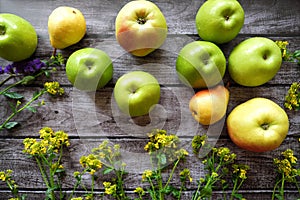 Fresh fruit apples and pears on a brown background