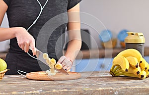 Fresh fruit is being cut into pieces on kitche