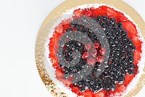 Fresh fruit cake on white background