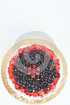 Fresh fruit cake on white background