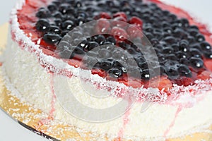 Fresh fruit cake on white background