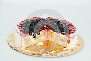 Fresh fruit cake on white background