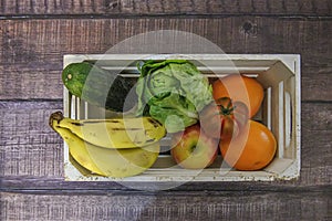 Fresh fruit delivery box on blue background, top view