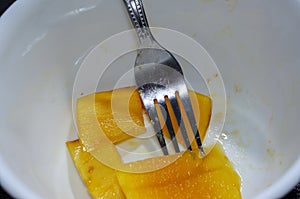 Fresh fruit with fork serve after meal ready to eat