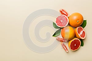 fresh Fruit grapefruit with Juicy grapefruit slices on colored background. Top view. Copy Space. creative summer concept