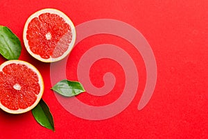 fresh Fruit grapefruit with Juicy grapefruit slices on colored background. Top view. Copy Space. creative summer concept