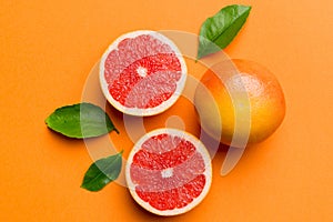 fresh Fruit grapefruit with Juicy grapefruit slices on colored background. Top view. Copy Space. creative summer concept. Half of