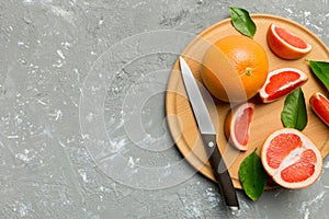 fresh Fruit grapefruit slices on colored background. Top view. Copy Space. creative summer concept. Half of citrus in