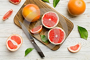 fresh Fruit grapefruit slices on colored background. Top view. Copy Space. creative summer concept. Half of citrus in