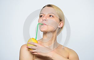 Fresh fruit juice. lemon battery. woman with hobnail at lemon. vitamin diet food. healthy skin. energy and positive mood