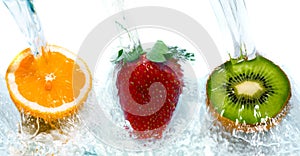 Fresh fruit jumping into water