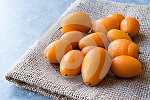 Fresh Fruit Kumquat / Cumquat on a Sack photo