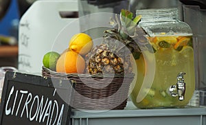 Fresh fruit lemonade with ripe fruits at farmers stall.