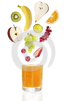 Fresh fruit over glass of multi vitamine juice