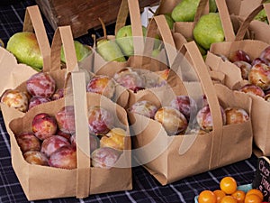 Fresh fruit in paper sacks at farmers market
