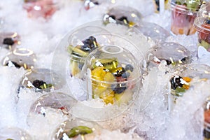 Fresh fruit in plastic cups