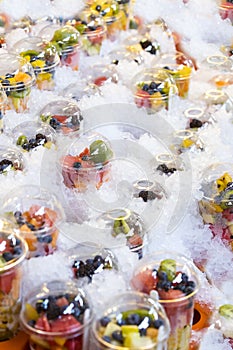 Fresh fruit in plastic cups