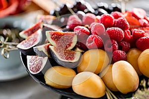 Fresh Fruit platter on banquet table at business or wedding event venue. Self service or all you can eat - raspberry photo