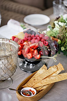 Fresh Fruit platter on banquet table at business or wedding event venue. Self service or all you can eat - raspberry photo