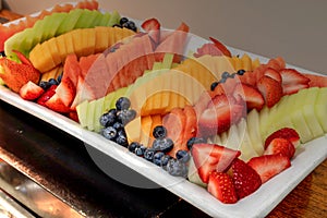 Fresh fruit platter including watermelon, cantaloupe, honeydew m