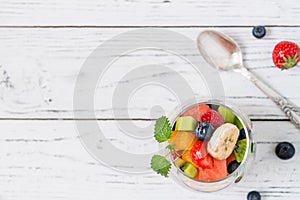 Fresh fruit salad in glass. Copy space