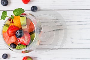 Fresh fruit salad in glass. Copy space