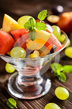 Fresh fruit salad with watermelon, plums, nectarines and grape