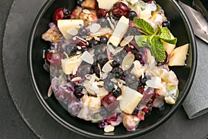 Fresh fruit salad . Mixed fruit in white bowl healthy food style. Useful fruit salad of fresh fruits and berries on p