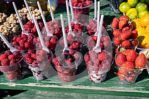 Fresh fruit stall, strawberry, raspberry, orange