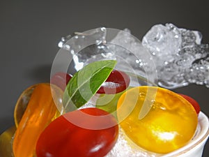 Fresh fruits background.Slices of fresh fruits top view on ice