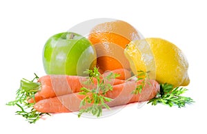 Fresh fruits and carrot on a white background