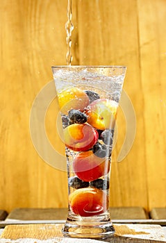 Fresh fruits in glass of water