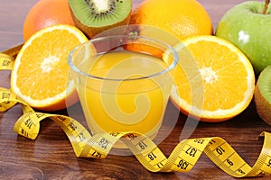 Fresh fruits, juice and tape measure, healthy lifestyles and nutrition