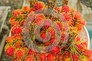 Fresh fruits rambutans background, Red rambutans and yellow rambutans in a  local market