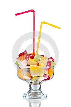 Fresh fruits salad in bowl and berries,